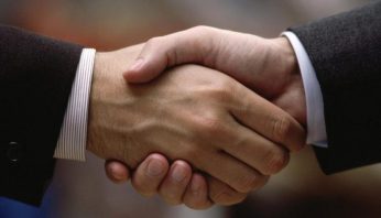 Close-up of two businessmen shaking hands